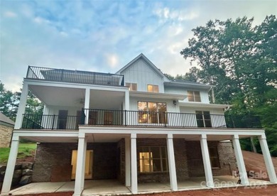 Stately new Lake Tillery home nestled in a quit cove in the on The Tillery Tradition Country Club in North Carolina - for sale on GolfHomes.com, golf home, golf lot