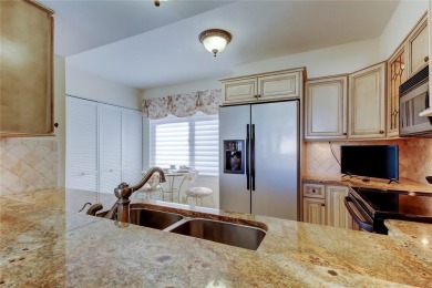 Perched on the top corner of the building, this 2-bedroom on Isla Del Sol Yacht and Country Club in Florida - for sale on GolfHomes.com, golf home, golf lot