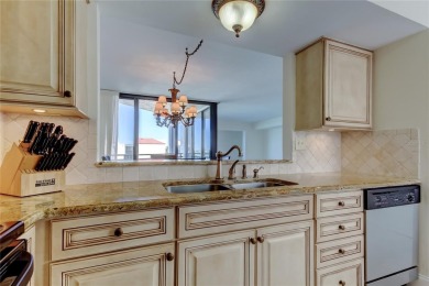 Perched on the top corner of the building, this 2-bedroom on Isla Del Sol Yacht and Country Club in Florida - for sale on GolfHomes.com, golf home, golf lot