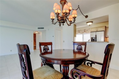Perched on the top corner of the building, this 2-bedroom on Isla Del Sol Yacht and Country Club in Florida - for sale on GolfHomes.com, golf home, golf lot