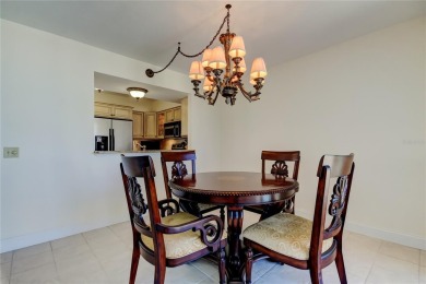 Perched on the top corner of the building, this 2-bedroom on Isla Del Sol Yacht and Country Club in Florida - for sale on GolfHomes.com, golf home, golf lot