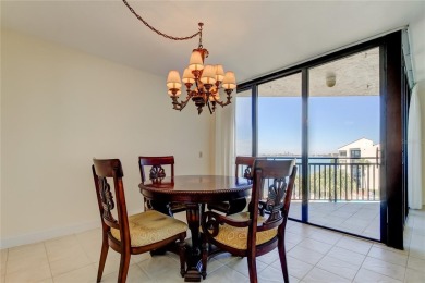 Perched on the top corner of the building, this 2-bedroom on Isla Del Sol Yacht and Country Club in Florida - for sale on GolfHomes.com, golf home, golf lot