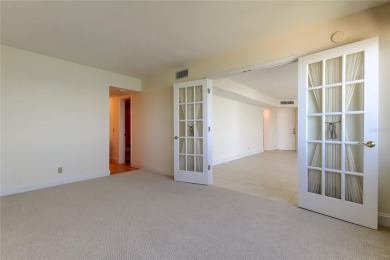 Perched on the top corner of the building, this 2-bedroom on Isla Del Sol Yacht and Country Club in Florida - for sale on GolfHomes.com, golf home, golf lot