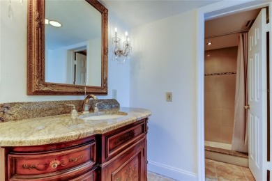 Perched on the top corner of the building, this 2-bedroom on Isla Del Sol Yacht and Country Club in Florida - for sale on GolfHomes.com, golf home, golf lot