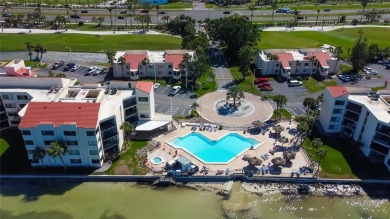 Perched on the top corner of the building, this 2-bedroom on Isla Del Sol Yacht and Country Club in Florida - for sale on GolfHomes.com, golf home, golf lot