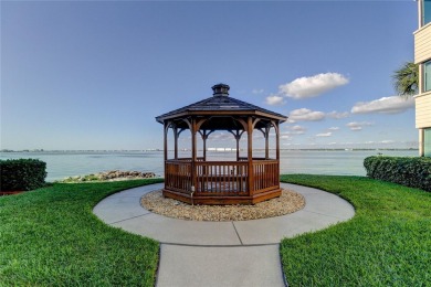 Perched on the top corner of the building, this 2-bedroom on Isla Del Sol Yacht and Country Club in Florida - for sale on GolfHomes.com, golf home, golf lot