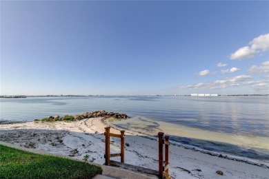Perched on the top corner of the building, this 2-bedroom on Isla Del Sol Yacht and Country Club in Florida - for sale on GolfHomes.com, golf home, golf lot