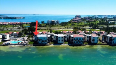 Perched on the top corner of the building, this 2-bedroom on Isla Del Sol Yacht and Country Club in Florida - for sale on GolfHomes.com, golf home, golf lot
