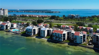 Perched on the top corner of the building, this 2-bedroom on Isla Del Sol Yacht and Country Club in Florida - for sale on GolfHomes.com, golf home, golf lot