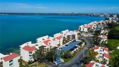 Perched on the top corner of the building, this 2-bedroom on Isla Del Sol Yacht and Country Club in Florida - for sale on GolfHomes.com, golf home, golf lot