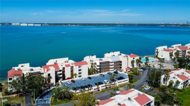 Perched on the top corner of the building, this 2-bedroom on Isla Del Sol Yacht and Country Club in Florida - for sale on GolfHomes.com, golf home, golf lot