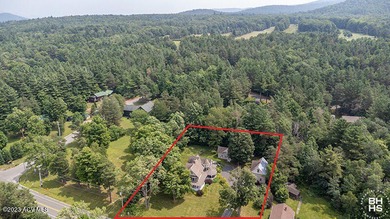 Logan's Bower is a meticulously restored Victorian home with a on Tupper Lake Country Club in New York - for sale on GolfHomes.com, golf home, golf lot