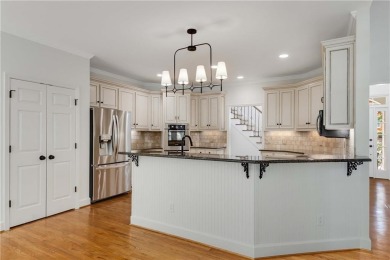 This beautiful home overlooks the golf course with primary on on The Golf Club of Georgia in Georgia - for sale on GolfHomes.com, golf home, golf lot
