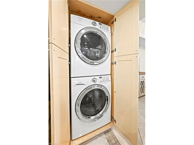 THE BEST VALUE IN BONITA BAY! FIRST FLOOR, 2 BED + DEN, COMPLETE on Bonita Bay West in Florida - for sale on GolfHomes.com, golf home, golf lot