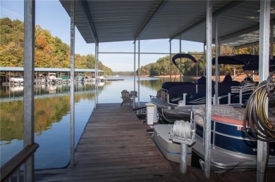 Nestled at the end of a serene cul-de-sac, this charming house on Lanier Island Legacy Golf Couorse in Georgia - for sale on GolfHomes.com, golf home, golf lot