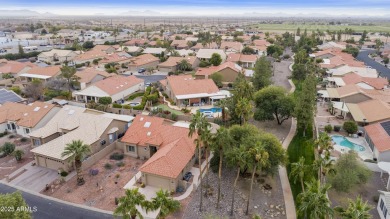 Nestled in a vibrant gated active adult community, this stunning on Palo Verde Golf and Country Club in Arizona - for sale on GolfHomes.com, golf home, golf lot