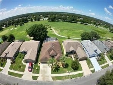 Life is better poolside! Wasting away again can be your on Arlington Ridge Golf Club in Florida - for sale on GolfHomes.com, golf home, golf lot