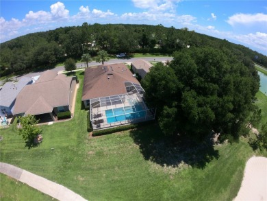 Life is better poolside! Wasting away again can be your on Arlington Ridge Golf Club in Florida - for sale on GolfHomes.com, golf home, golf lot