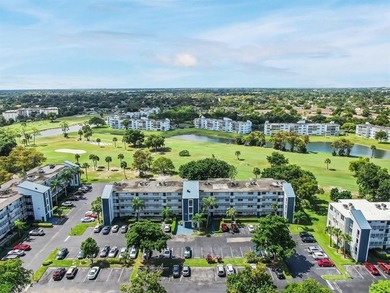 Beautifully updated top floor condo in the 55+ community of Palm on Oriole Golf and Tennis Club in Florida - for sale on GolfHomes.com, golf home, golf lot