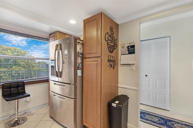 Beautifully updated top floor condo in the 55+ community of Palm on Oriole Golf and Tennis Club in Florida - for sale on GolfHomes.com, golf home, golf lot