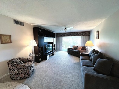 SELLER IS MOTIVATED. Imagine Sipping your Coffee Enjoying this on Wynmoor Golf Course in Florida - for sale on GolfHomes.com, golf home, golf lot