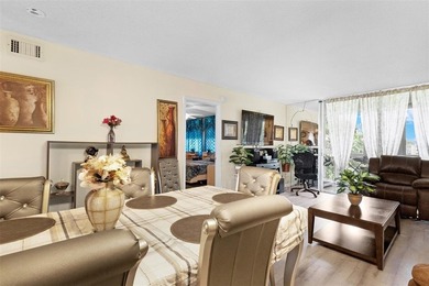 Beautifully updated top floor condo in the 55+ community of Palm on Oriole Golf and Tennis Club in Florida - for sale on GolfHomes.com, golf home, golf lot