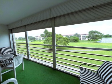 Imagine Sipping your Coffee Enjoying this Wide WATER/GOLF VIEW on Wynmoor Golf Course in Florida - for sale on GolfHomes.com, golf home, golf lot