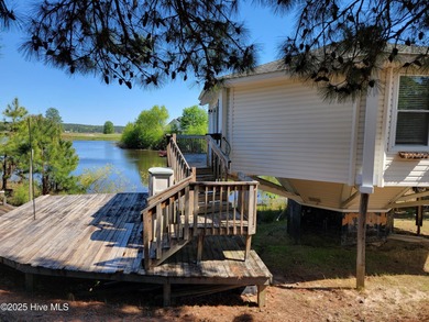 2 bedroom 2 bath waterfront home in Woodlake Country Club on Woodlake Country Club in North Carolina - for sale on GolfHomes.com, golf home, golf lot