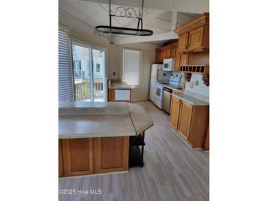 2 bedroom 2 bath waterfront home in Woodlake Country Club on Woodlake Country Club in North Carolina - for sale on GolfHomes.com, golf home, golf lot