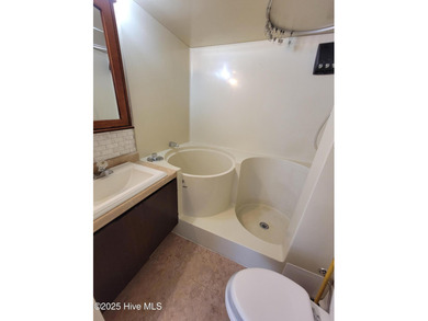 2 bedroom 2 bath waterfront home in Woodlake Country Club on Woodlake Country Club in North Carolina - for sale on GolfHomes.com, golf home, golf lot