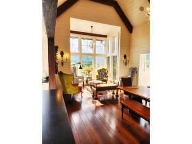 Classic in every sense of the word, this mountain chalet on Lake Toxaway Country Club in North Carolina - for sale on GolfHomes.com, golf home, golf lot
