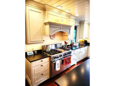 Classic in every sense of the word, this mountain chalet on Lake Toxaway Country Club in North Carolina - for sale on GolfHomes.com, golf home, golf lot