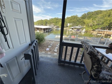 Lakefront Living at Heron Bay! Located at the 21mm, this on Sycamore Creek Golf Club in Missouri - for sale on GolfHomes.com, golf home, golf lot