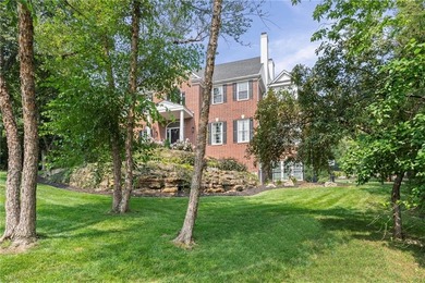 Welcome to this custom-built colonial home in the prestigious on Loch Lloyd Country Club in Missouri - for sale on GolfHomes.com, golf home, golf lot