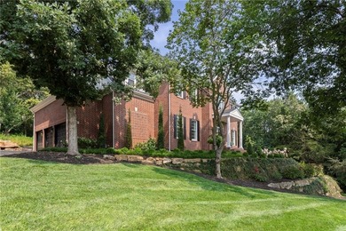 Welcome to this custom-built colonial home in the prestigious on Loch Lloyd Country Club in Missouri - for sale on GolfHomes.com, golf home, golf lot
