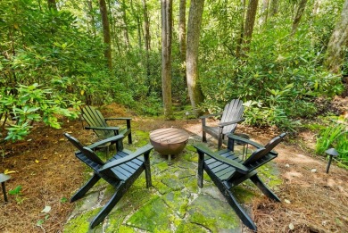 This beautiful, updated home located in Sapphire Valley sits on on Sapphire National Golf Club in North Carolina - for sale on GolfHomes.com, golf home, golf lot