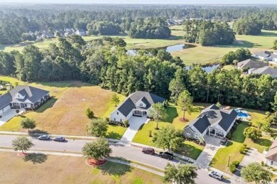 This brand-new custom home boasts 5 spacious bedrooms and 4 on Wild Wing Plantation in South Carolina - for sale on GolfHomes.com, golf home, golf lot