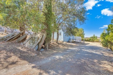 Discover a slice of vintage charm in this affordable barn-style on The Club at Copper Valley Golf Course in California - for sale on GolfHomes.com, golf home, golf lot