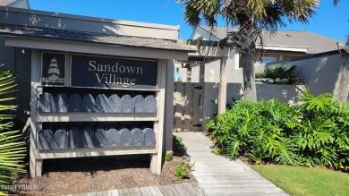 Before stepping into this beautiful 2BR/2BA Sanddown home, pause on Ocean Creek Golf Course in South Carolina - for sale on GolfHomes.com, golf home, golf lot