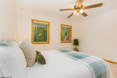 Welcome to 'Nature's Nook', a beautiful cape cod cabin located on Alpine Lake Resort in West Virginia - for sale on GolfHomes.com, golf home, golf lot