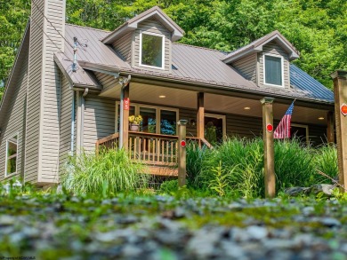Welcome to 'Nature's Nook', a beautiful cape cod cabin located on Alpine Lake Resort in West Virginia - for sale on GolfHomes.com, golf home, golf lot
