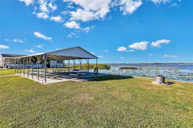 Under contract-accepting backup offers. Seller offering up to a on Lake Henry Golf Club in Florida - for sale on GolfHomes.com, golf home, golf lot