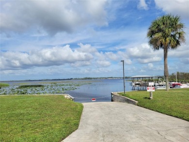 Under contract-accepting backup offers. Seller offering up to a on Lake Henry Golf Club in Florida - for sale on GolfHomes.com, golf home, golf lot