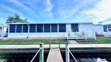 Welcome to your dream WATERFRONT home in Old Bridge Village! on Riverbend Golf and Country Club in Florida - for sale on GolfHomes.com, golf home, golf lot