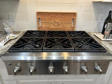 You Will Find This Seamless And Exquisite 4 Bedroom 3.5 Bath on Lake Caroline Golf Club in Mississippi - for sale on GolfHomes.com, golf home, golf lot