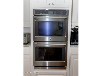 You Will Find This Seamless And Exquisite 4 Bedroom 3.5 Bath on Lake Caroline Golf Club in Mississippi - for sale on GolfHomes.com, golf home, golf lot