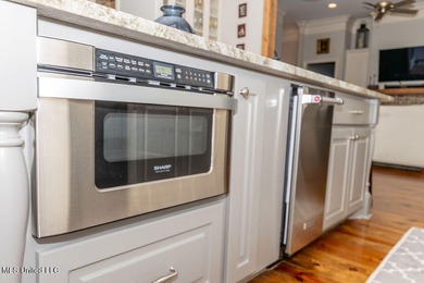 You Will Find This Seamless And Exquisite 4 Bedroom 3.5 Bath on Lake Caroline Golf Club in Mississippi - for sale on GolfHomes.com, golf home, golf lot