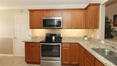 Welcome home to this beautifully maintained Jasmine II 3-bedroom on Glenview Championship Golf and Country Club in Florida - for sale on GolfHomes.com, golf home, golf lot