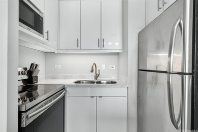 Beautifully renovated, pet-friendly penthouse unit with sweeping on Ala Wai Golf Course in Hawaii - for sale on GolfHomes.com, golf home, golf lot