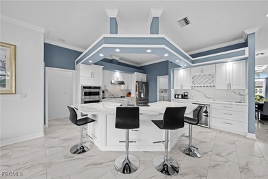 Highly desirable Gulf access home in Southwest Cape Coral, fully on Royal Tee Country Club in Florida - for sale on GolfHomes.com, golf home, golf lot